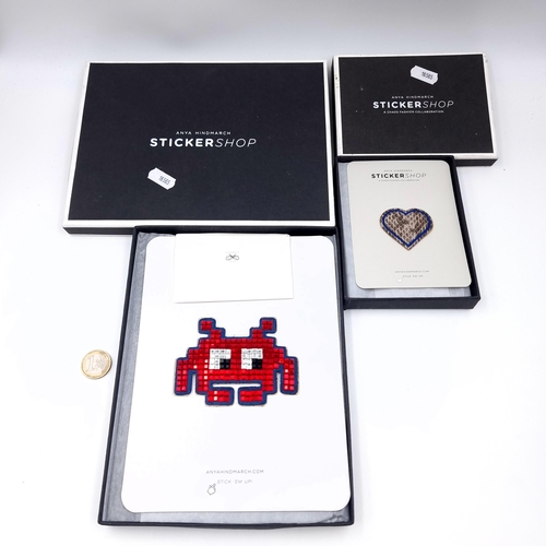 735 - Two boxed items from the Anya Hindmarch Stickershop consisting of a heart patch badge and a luminous... 