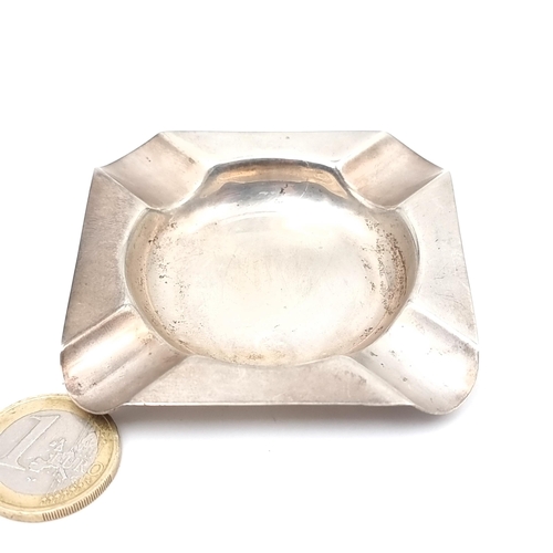 743 - An Irish silver ashtray, 6.5cm square, weight 26.24 grams.