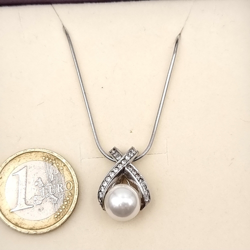 746 - A sterling silver pearl mounted pendant with chain, length 42cm, boxed.