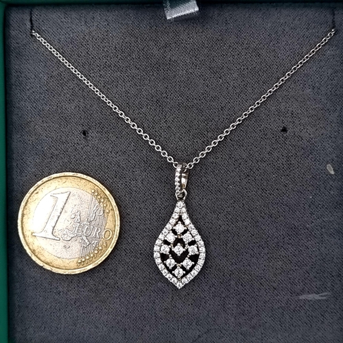 747 - A gem set tear drop pendant set with sterling silver chain, length of chain 44cm, boxed.