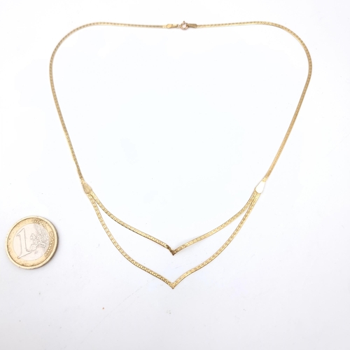 749 - A 9K gold (375) double V flat link necklace, weight 2 grams, boxed.