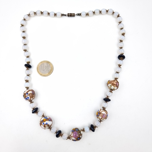 751 - A very pretty polished moonstone necklace, length 50cm, with screw clasp, weight 55 grams, stones co... 