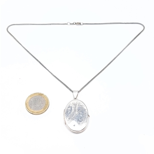 759 - A sterling silver pendant locket with chain. length of 40cm, total weight 12 grams.