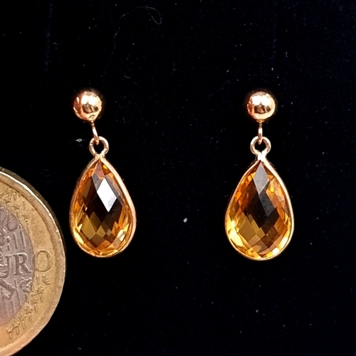 764 - A pair of elegant 9K gold Citrine stud earrings with butterfly backs, boxed.