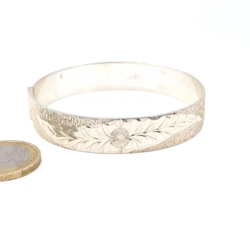 766 - A sterling silver bracelet with floral design, hallmarked Birmingham, weight 28 grams.