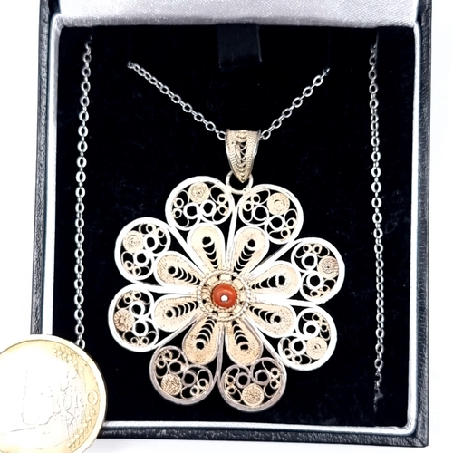 773 - A vintage silver leaf design pendant and chain, pendant 4cm diameter, chain 44cm, boxed.