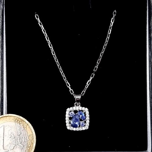 776 - A sterling silver tazanite necklace with white sapphire surround, length of chain 46cm, boxed, never... 