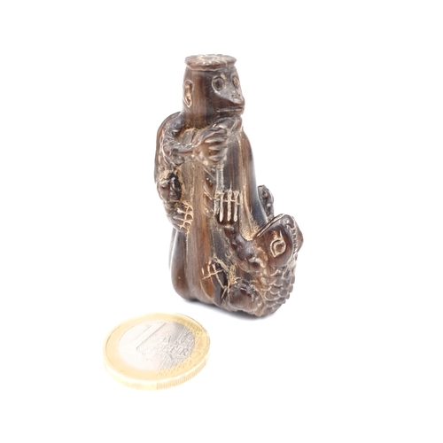 779 - A vintage carved netsuki figure of a standing monkey with a tortoise and toad with marks to base,5.5... 