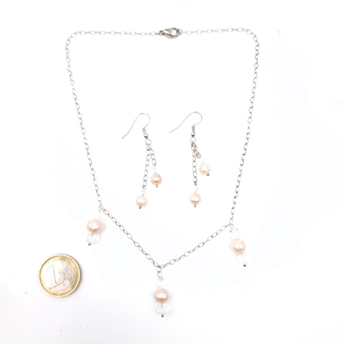 790 - A pearl set necklace with matching earrings, suitable for pierced ears.