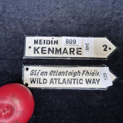 809 - Two cast metal direction road plaques for Kenmare and Wild Atlantic Way.