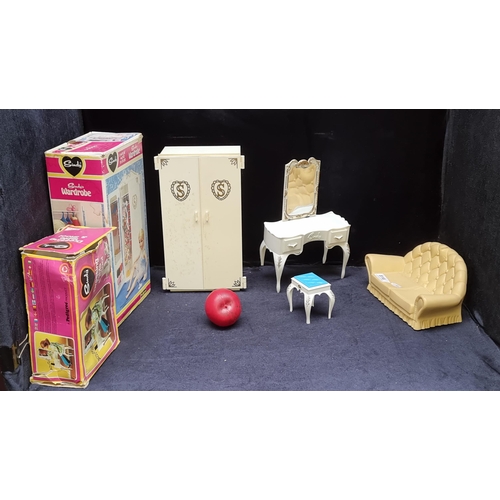 816 - Three fantastic retro Sindy doll accessories including a sofa, a dressing table with stool and a war... 