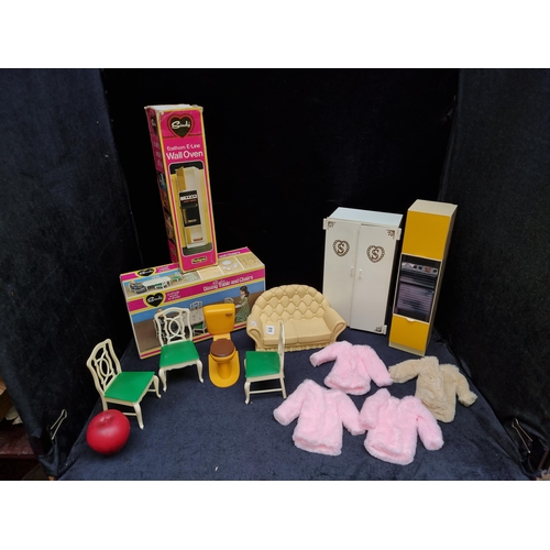 819 - Four very fun retro Sindy doll accessories including a wardrobe, a sofa, a dining table with chairs ... 