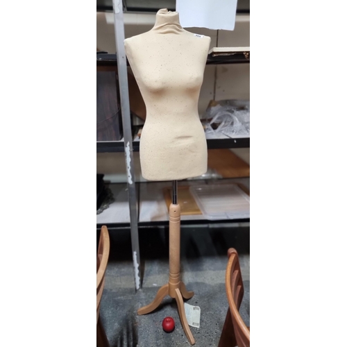 869 - A freestanding mannequin upholstered in a soft mesh fabric, perfect for making alterations or tailor... 