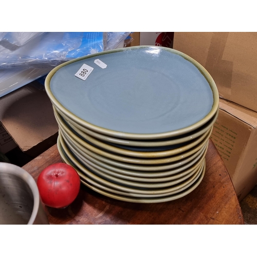 880 - A set of eleven modern commercial quality heavy Olympia dinner plates in an unusual triangular shape... 