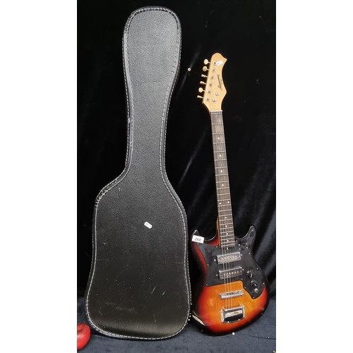 268 - Star lot: A rare vintage Harmony electric guitar with all strings, a black and brown finish and blac... 