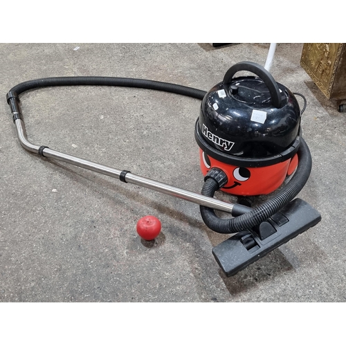 891 - A Henry Vacuum cleaner from Numatic International with pipe and brush end, he always has that cheeky... 