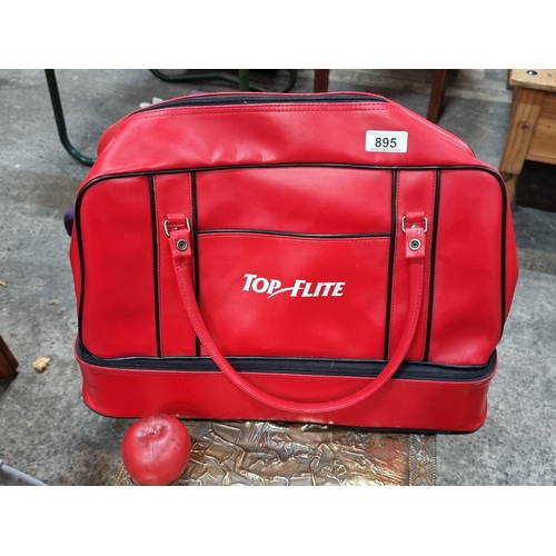 895 - A stylish 1980s Top Flite duffle bag in a vibrant red finish. With zip up compartments and removable... 