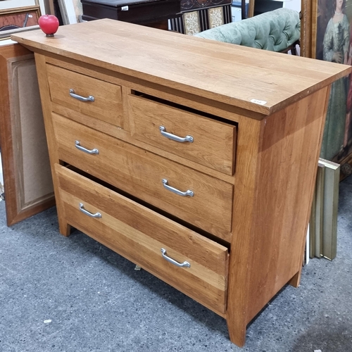 918 - A modern dresser with five drawers featuring chrome handles.