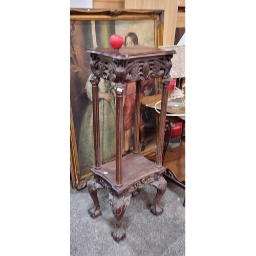 919 - A very ornate early 20th century plant stand with profusely carved detailing, shelf to base and ball... 