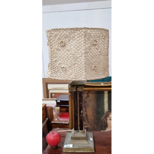 926 - An elegant vintage table lamp with an unusual columnar wooden stem, brass detail and cream crochet s... 