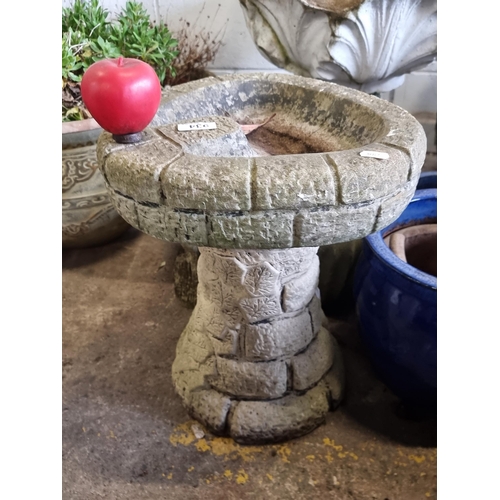 934 - A very heavy reconstituted stone garden bird bath with faux brick design.