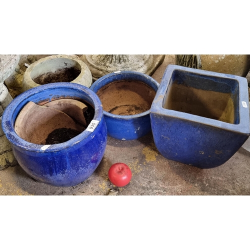 935 - 3 heavy terracotta planters including a square example along with 2 graduated circular examples. All... 