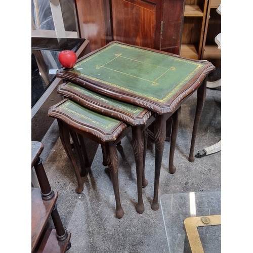 858 - A lovely vintage set of nesting tables with tooled leather top, carved edges held on cabriole legs. ... 