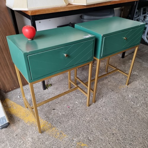 951 - A stylish pair of Art Deco style contemporary bedside lockers, in an emerald green with gold toned f... 