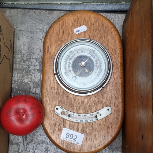 992 - A handsome early 20th century barometer held on a wooden plaque.