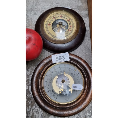 993 - Two vintage barometers including a West German example and another from Baymaster. Slight loss to ca... 