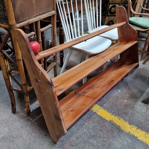 427 - An antique pine good size wall shelving unit with three shelves and fittings for hanging. L 110cm x ... 