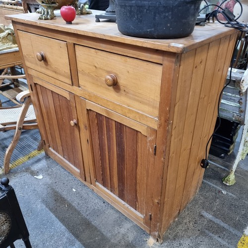 469 - Star Lot : An antique  pine buffet cabinet / sideboard with two deep top drawers and large cupboard ... 