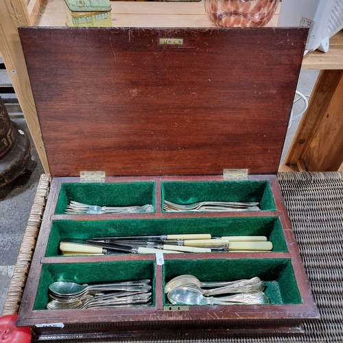 915 - A handsome vintage canteen containing approx. 50 utensils including silverplated spoons and forks, a... 