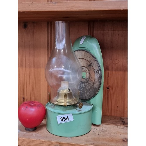 854 - A wonderful vintage green paraffin oil lamp with weighted base.