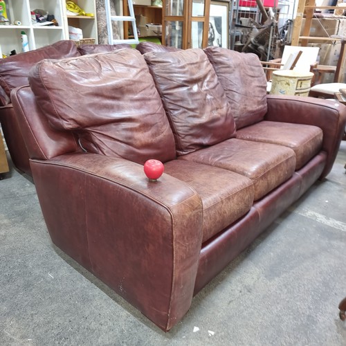 894 - A high quality three-seater brown leather sofa. Good condition genuine leather, strong masculine loo... 