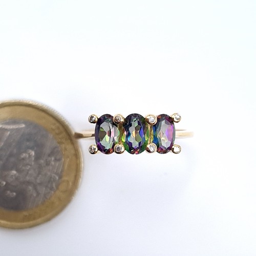 1 - Star Lot : A beautiful unusual three stone claw set 9K gold mystic topaz ring, ring size N, weight 2... 