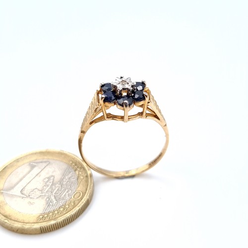 9 - A pretty sapphire and diamond ring with broad diamond cut shoulders, size O, weight 2 grams.