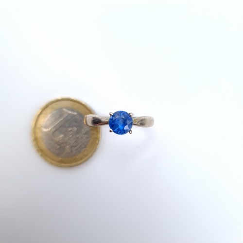 21 - A sterling silver blue gemstone ring size O, weight 2.58 grams.