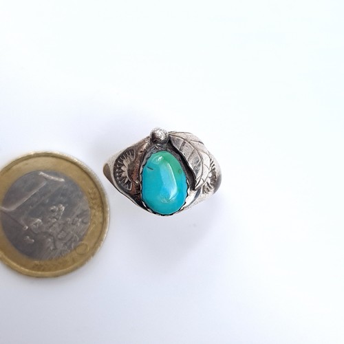 23 - A sterling silver turquoise ring with leaf motif, ring size P, weight 3.84 grams.