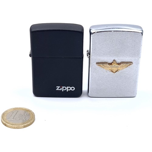 34 - A collection of two Zippo flint lighters.