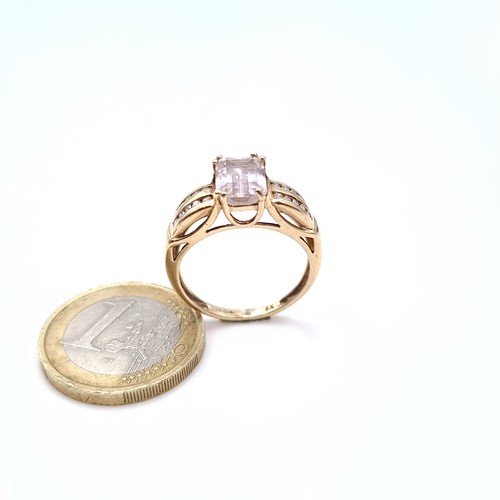 673 - Star Lot : A very attractive pink quartz  ring with 20 diamond channel cut shoulders, size P, weight... 