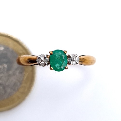 674 - Star Lot : A super pretty emerald and diamond 9K gold ring, size O, weight 1.68 grams.