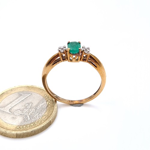 674 - Star Lot : A super pretty emerald and diamond 9K gold ring, size O, weight 1.68 grams.