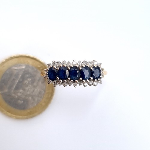 686 - Star Lot : A stunning example of a five stone sapphire ring with diamond mount, diamond stamped to b... 