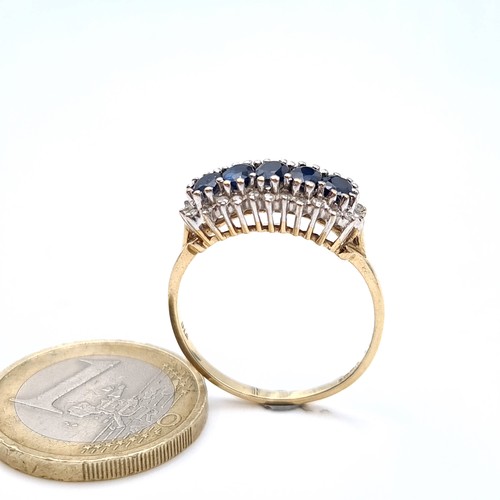 686 - Star Lot : A stunning example of a five stone sapphire ring with diamond mount, diamond stamped to b... 