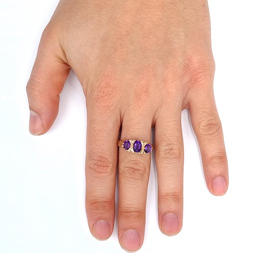 687 - Star Lot : A very pretty antique 9K gold ring, set with 3 amethyst stones with diamond accents, size... 