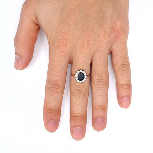 688 - Star Lot : A large sapphire stone ring with gem stone mount set in 9K gold, size M 1/2, weight 2.21 ... 