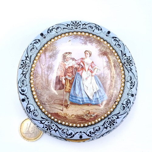 691 - Star Lot : A pretty vintage hinged dish set with a gilded rim ad seed pearl inlay surround, depictin... 