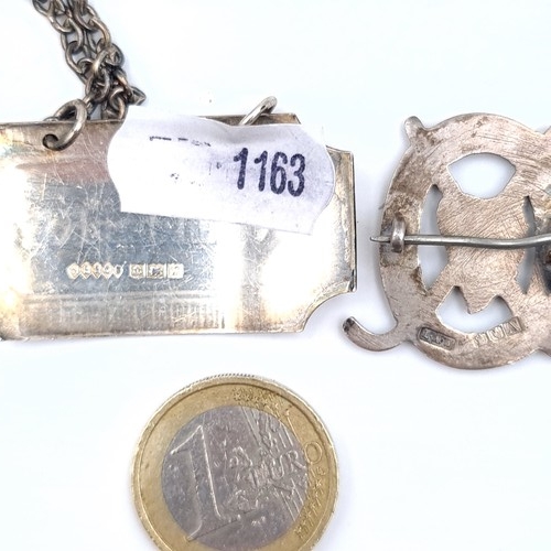 693 - An Irish silver hockey badge, pin intact together with a sterling silver whiskey decanter label and ... 