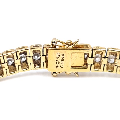 707 - A stunning silver gilt, Sterling Silver bracelet fitted with eye-catching gemstones and set with dou... 